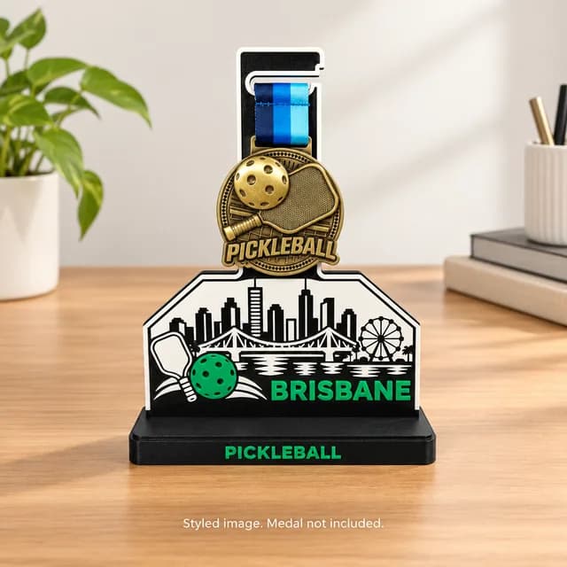 Brisbane medal stand holding a pickleball medal on a desk