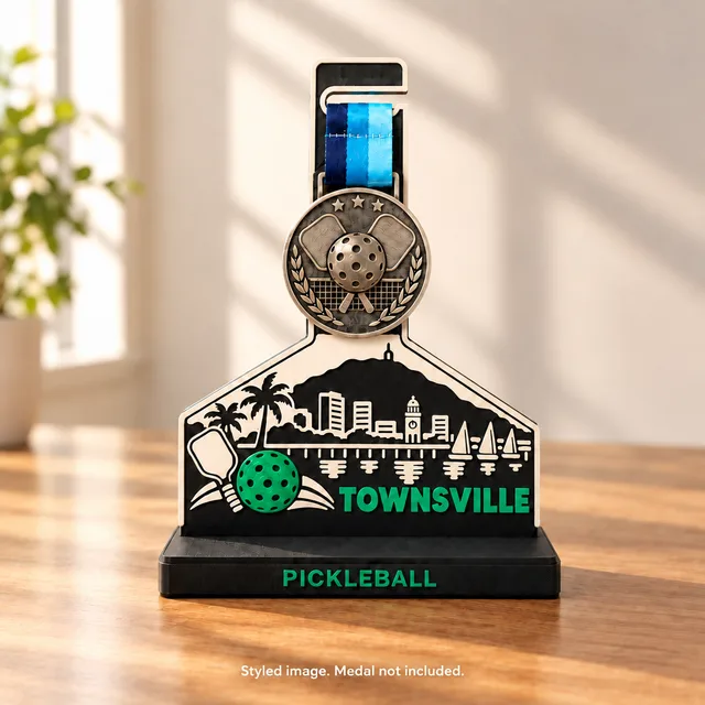 Townsville medal stand holding a pickleball medal on a desk